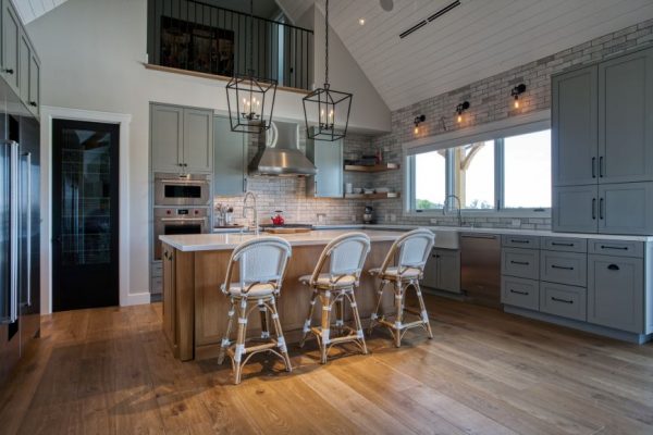 Modern Farmhouse. Cabinets by Wood-Mode painted in Nimbus color with the island made in rift cut white oak. Cambria quartz countertops. Floating shelves. Sub Zero and Wolf appliances.